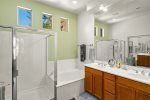 The en-suite bathroom is spacious with a double vanity and luxury of both a large bath and walk-in shower